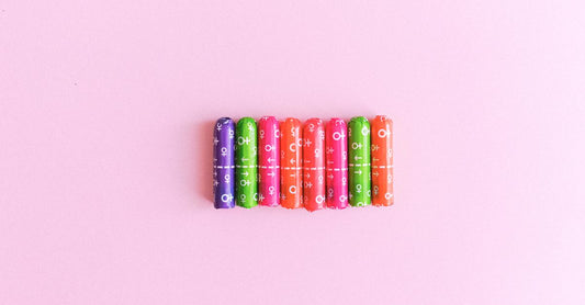 A flatlay of assorted tampons in a neat box, representing a UK tampons buying guide for choosing the right period product.