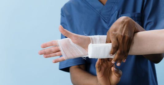 Selection of sterile gauze rolls and pads for first aid wound care, illustrating how to choose gauze UK.