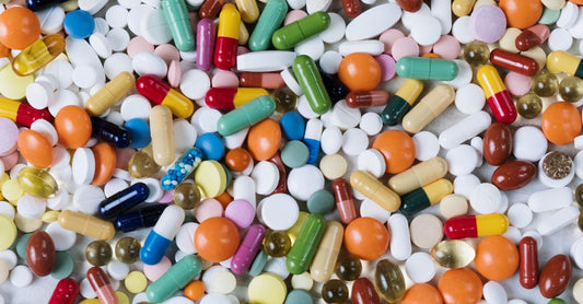 Vitamin B12 supplement bottles and capsules on a clean surface, representing the best B12 UK 2026 options for energy and nerve health.