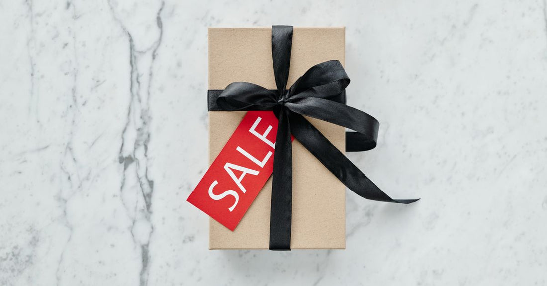 A flatlay of wellness products including supplement bottles and a card, representing a health care buying guide UK for gift buyers.