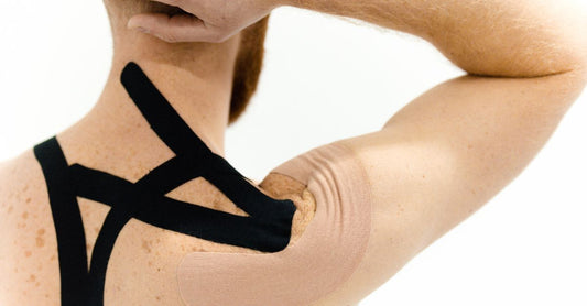 A roll of white paper tape for sensitive skin on a soft pastel background, highlighting its gentle, breathable texture.