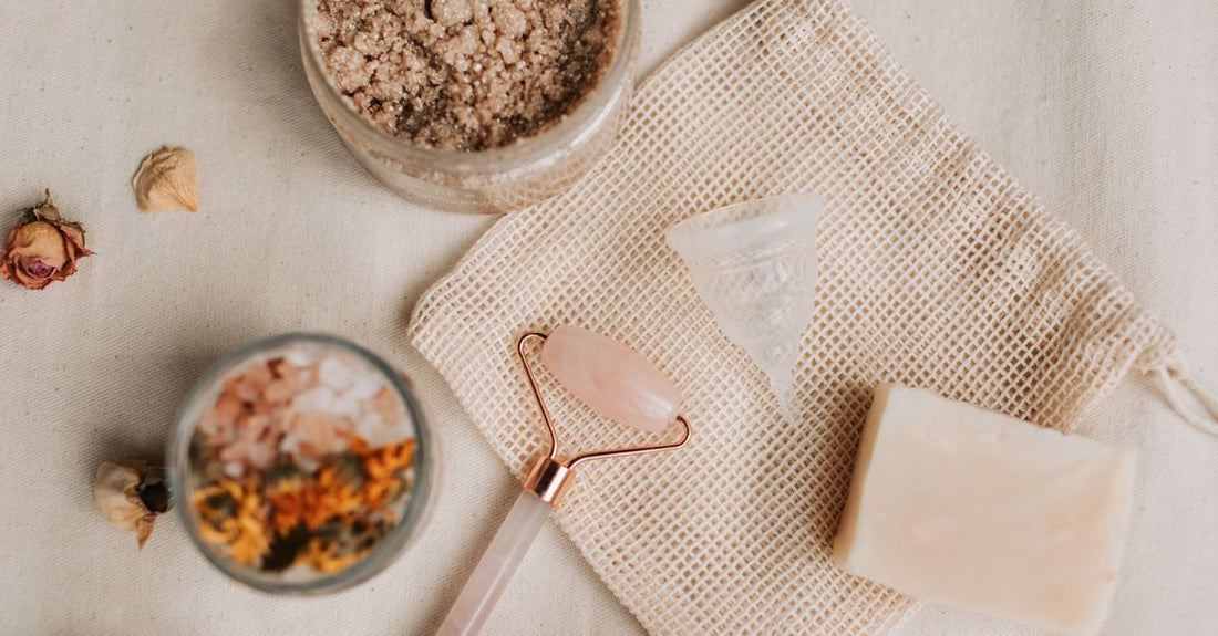 A flatlay of different cleansing cloths, swabs and wipes including cotton pads and disposable wipes, relevant to a cleansing cloths, swabs & wipes buying guide UK.