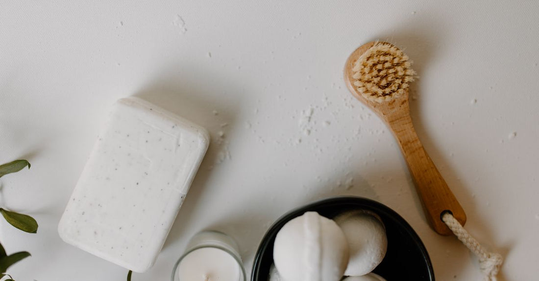 An arrangement of cleansers, cloths and creams on a white surface, illustrating a buying guide for UK vitamin and mineral store shoppers.