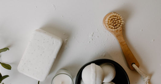 An arrangement of cleansers, cloths and creams on a white surface, illustrating a buying guide for UK vitamin and mineral store shoppers.