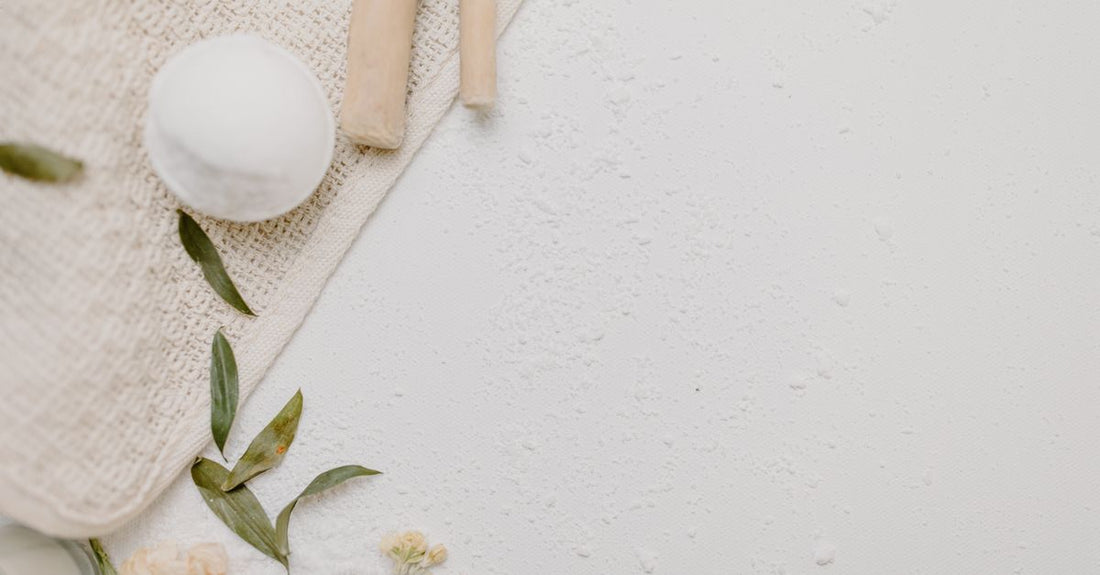 A flatlay of various cleansing cloths, swabs and wipes on a light surface, showcasing a cleansing cloths, swabs & wipes buying guide UK.