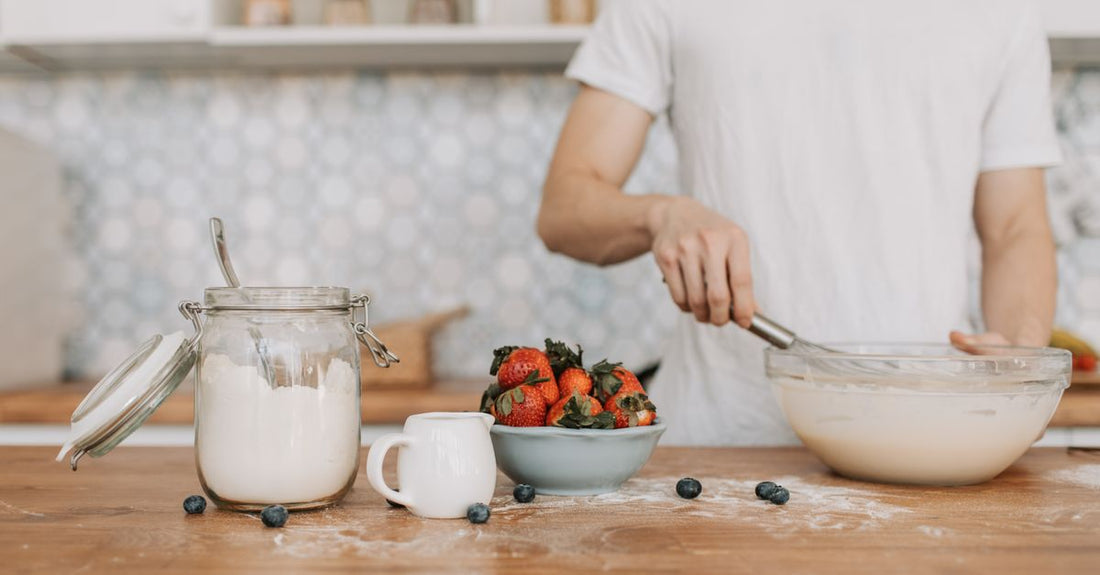 A bowl of organic ashwagandha root powder with a wooden scoop, representing the best ashwagandha 2026 supplements for natural stress relief.