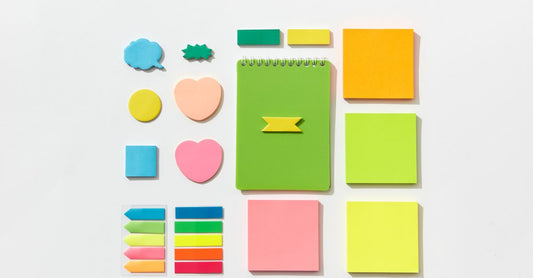 A selection of adhesive bandages in different sizes and materials laid out on a clean surface, illustrating the variety covered in this adhesive bandages buying guide.