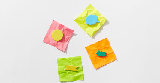 A flatlay assortment of the best adhesive bandages 2026, including transparent film dressings and hydrocolloid blister plasters on a clean white surface.