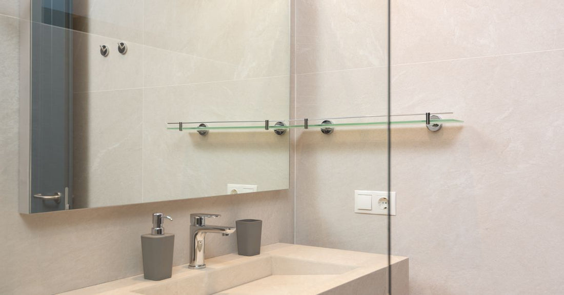 A selection of the best drain pouches UK 2026 displayed on a clean bathroom shelf, showcasing different brands and closure types for ileostomy and colostomy care.
