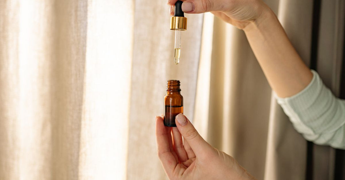 Bottle of pure vitamin E oil for scars on a clean, minimalist background at Nutrisentra.