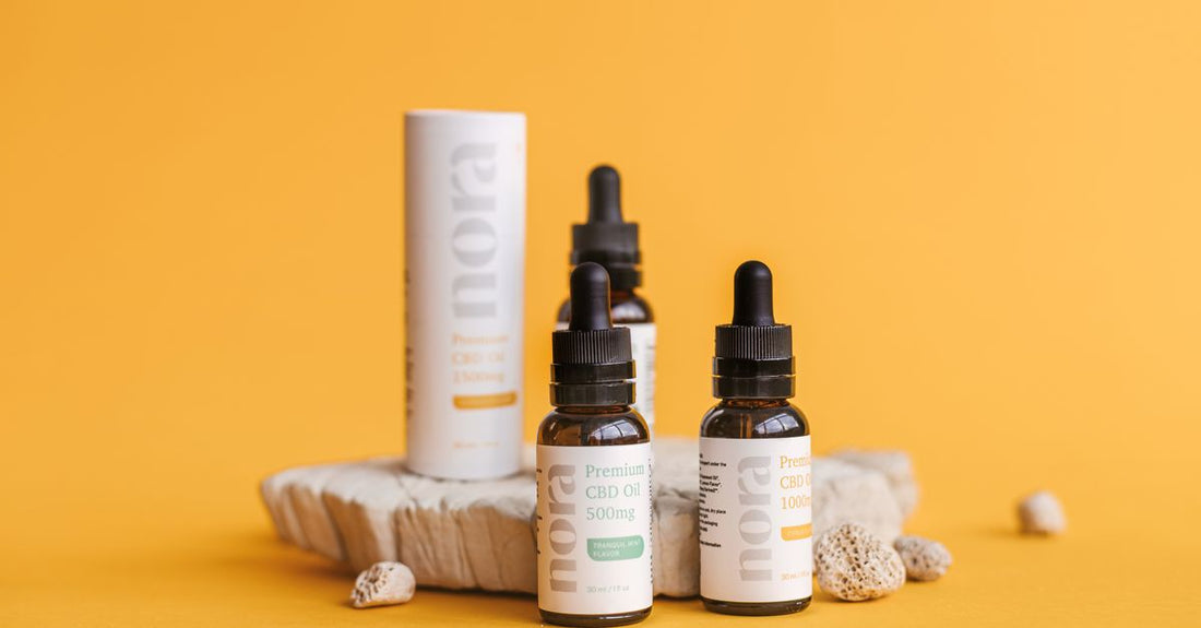 A selection of vitamin B12 supplements including sublingual tablets and liquid drops on a clean surface, illustrating a b12 buying guide.