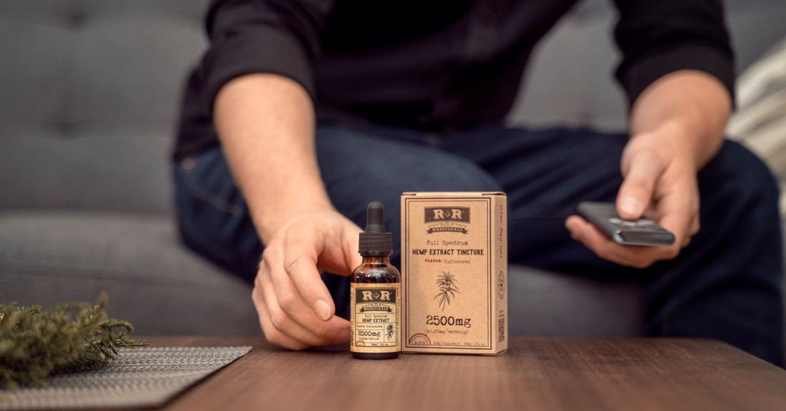 A bottle of cold-pressed hemp seed oil on a wooden surface, illustrating the hemp buying guide UK for premium supplement selection.