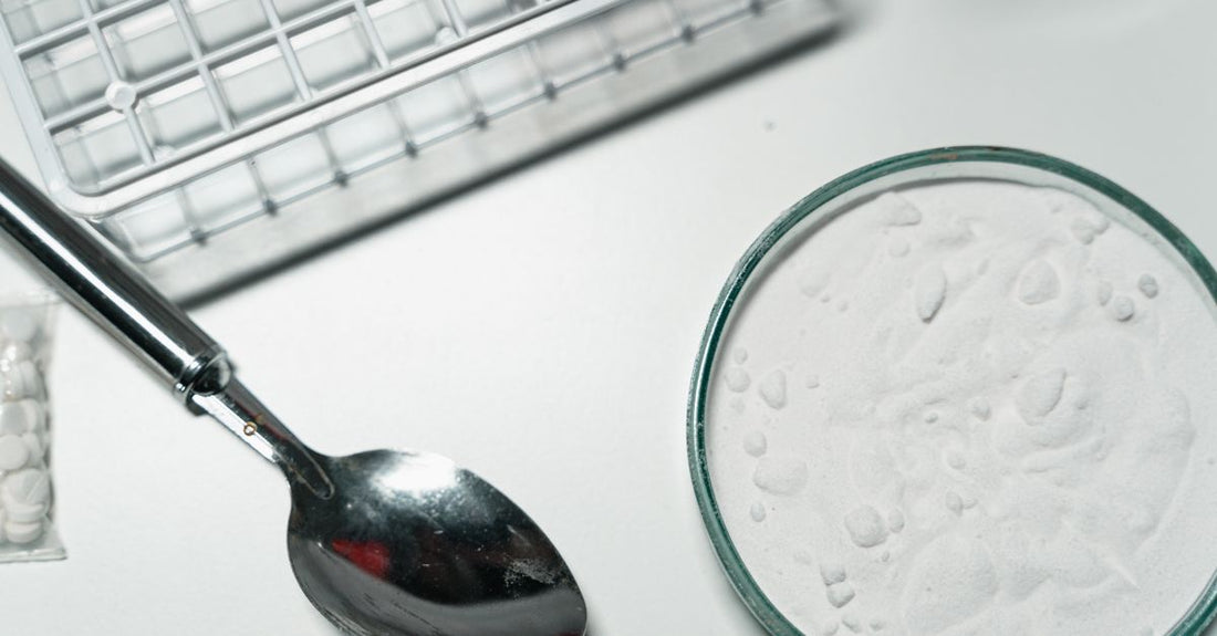 A bottle of potassium supplement capsules next to a glass of water, representing the best potassium UK 2026 safety guide.