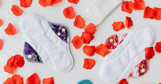 A selection of organic cotton panty liners for daily use laid out on a clean surface, showcasing their thin, breathable design.