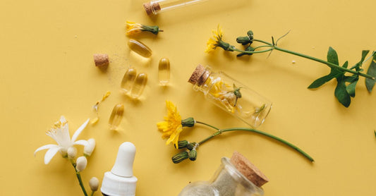 Best vitamin E UK 2026 supplement capsules and oil bottle on a neutral background.