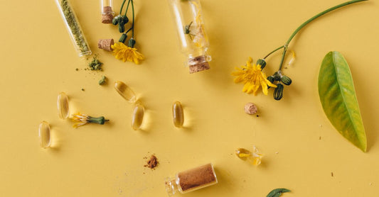 A flatlay of best blended vitamin & mineral supplements UK 2026 bottles and capsules on a clean surface.