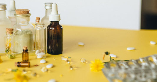 Glass bottle of olive leaf extract supplement on a clean surface, highlighting natural cold relief