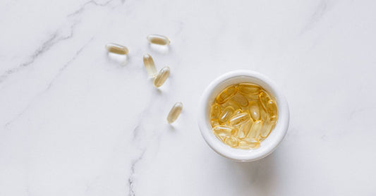 A row of fish oil supplement bottles lined up, representing the best fish oil UK 2026 options available at Nutrisentra.