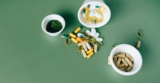 Bottle of digestive enzymes with probiotics capsules displayed on a clean white background, highlighting gut health supplements.