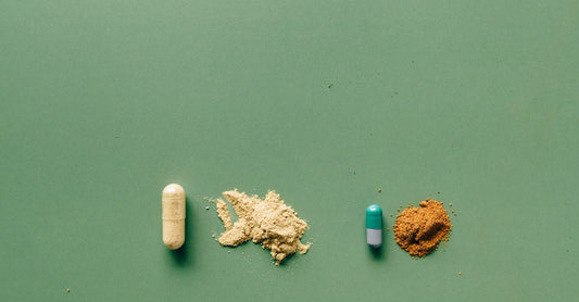 Assorted appetite suppressant capsules and supplement bottles arranged on a clean white surface, illustrating the appetite suppressant that works guide.