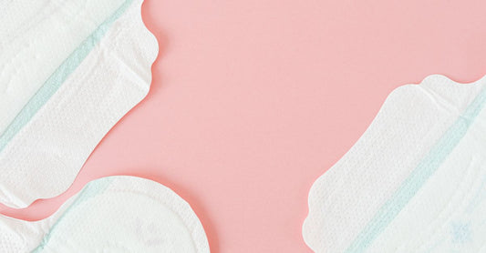 A selection of panty liners for daily use, including organic cotton and reusable options, arranged neatly on a light surface.