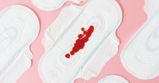 A selection of incontinence pads, liners, shields and guards laid out on a clean surface, illustrating the best pads, liners, shields & guards UK 2026.