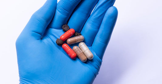 A bottle of tribulus terrestris capsules on a white background, illustrating how to choose tribulus UK supplements correctly.