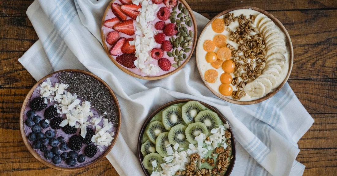 A flatlay of colourful antioxidant supplements including capsules and powders on a light marble surface, illustrating how to choose antioxidants for a gift.