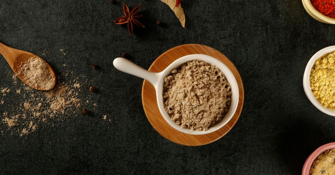 Organic psyllium husk powder in a wooden bowl with a spoon, representing the best psyllium UK 2026 for digestive health.