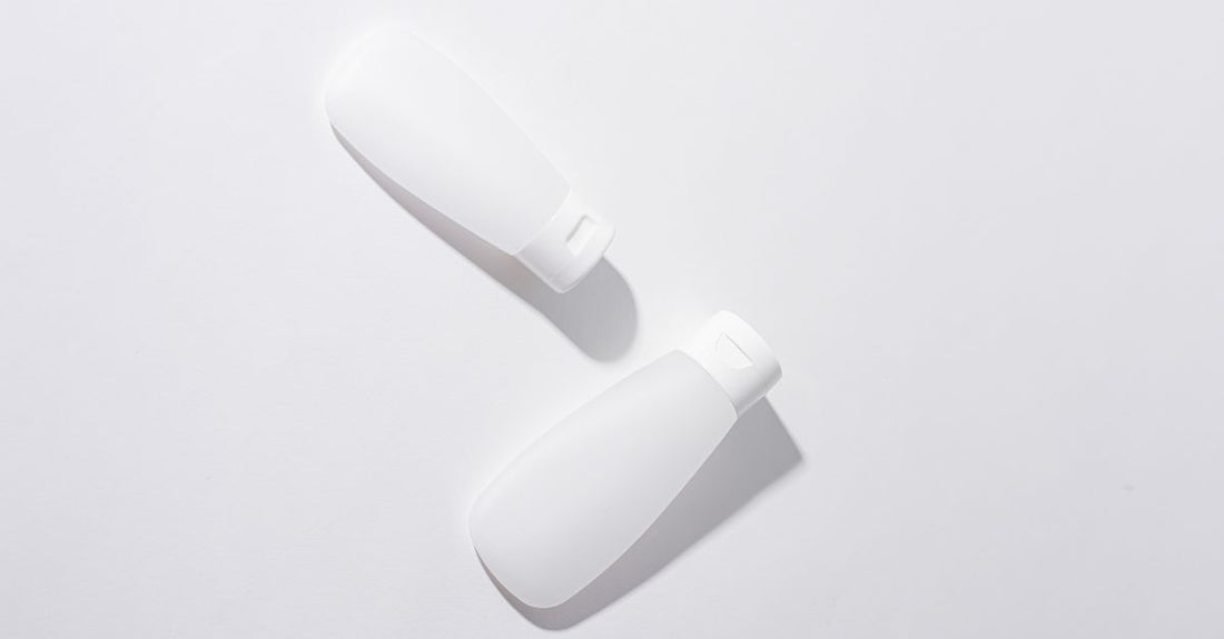 A minimalist bottle of gentle facial cleanser for sensitive skin on a light background.