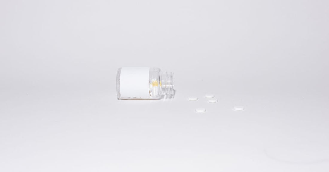 Zinc supplement bottle on a white background, representing zinc for immune system support.