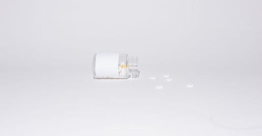 Zinc supplement bottle on a white background, representing zinc for immune system support.