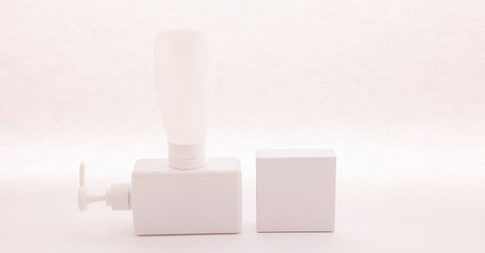 Athletes foot remedies buying guide featuring a white antifungal cream tube and a soothing foot powder on a clean surface, representing long-term relief options.
