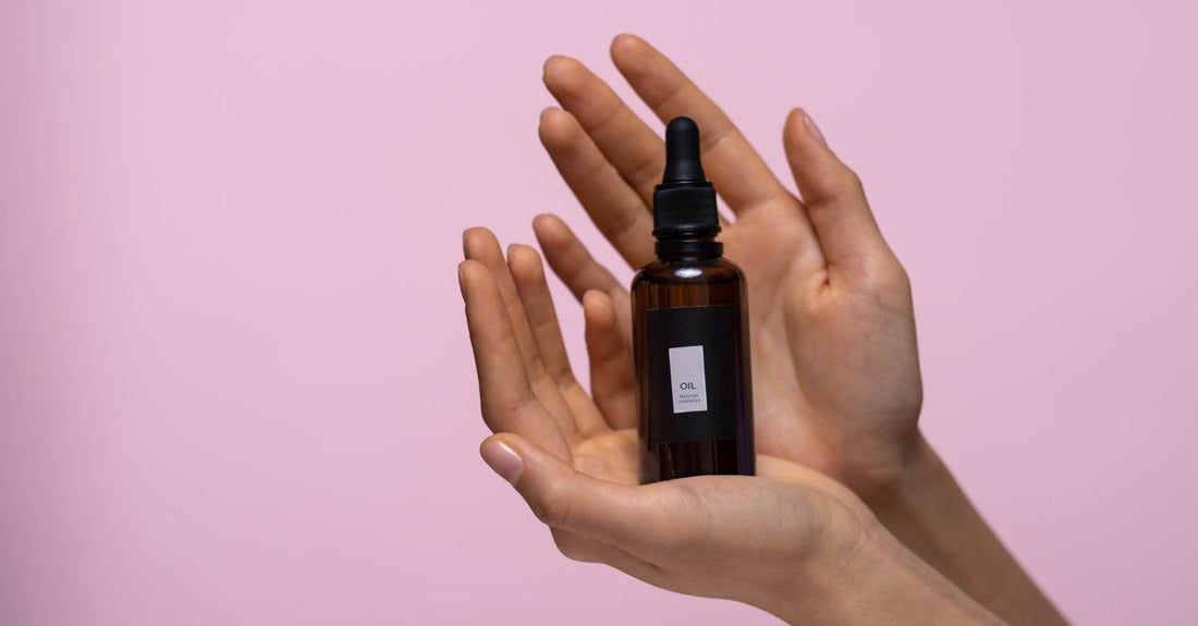 A glass bottle of pure black seed oil with fresh nigella sativa seeds on a neutral background, highlighting black seed oil benefits for UK shoppers.