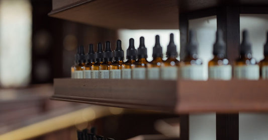 Assorted supplement bottles on a clean white shelf in a health care buying guide UK setting.