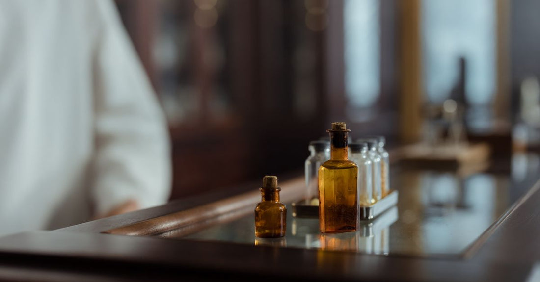 A collection of homeopathic medicine bottles and herbal supplement jars arranged on a shelf, representing the best alternative medicine UK 2026.
