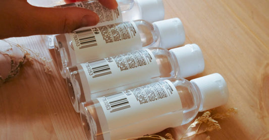 Hand sanitizers buying guide UK featuring various gel and spray bottles on a clean surface.