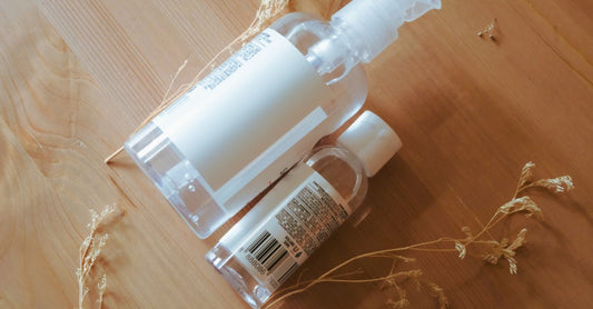 Assorted hand sanitizer bottles and wipes arranged on a clean surface, illustrating how to choose hand sanitizers UK