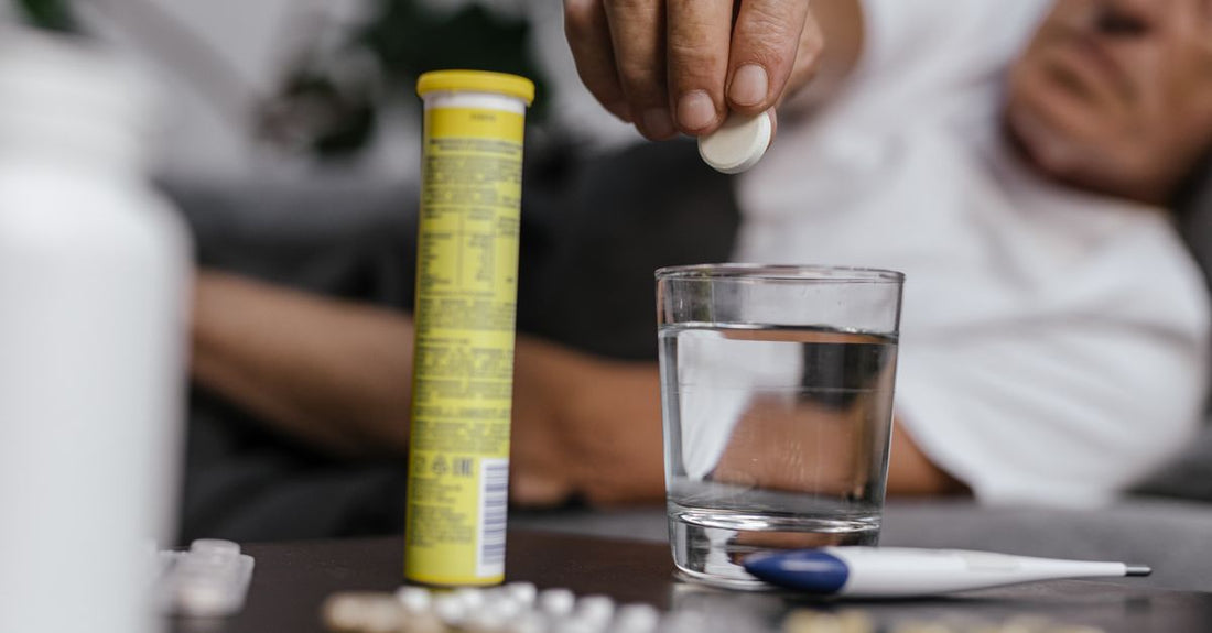 An array of vitamin B12 supplements including tablets, sublingual melts, and liquid drops on a white surface, illustrating a b12 buying guide for UK shoppers.