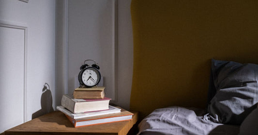 A sleek sleep sound machine on a bedside table with a soft night light glow, best sleep sound machines UK 2026