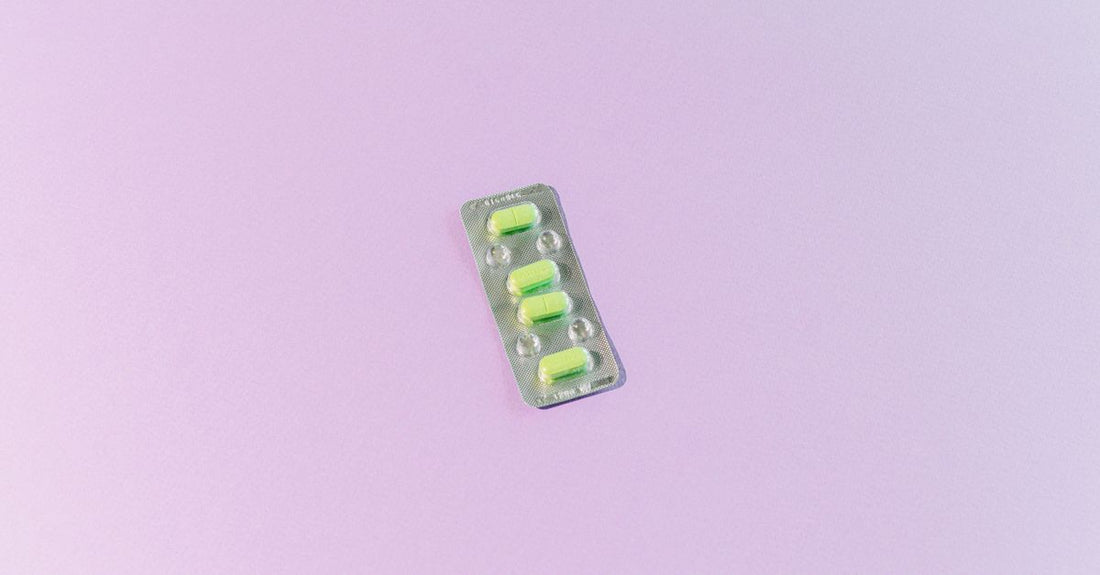 A selection of antifungal creams and capsules arranged on a light surface, illustrating how to choose antifungals for daily use.
