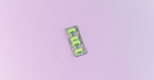 A selection of antifungal creams and capsules arranged on a light surface, illustrating how to choose antifungals for daily use.